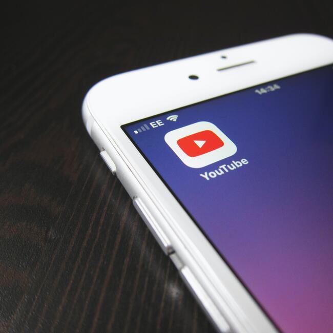YouTube app logo displayed on a mobile phone screen