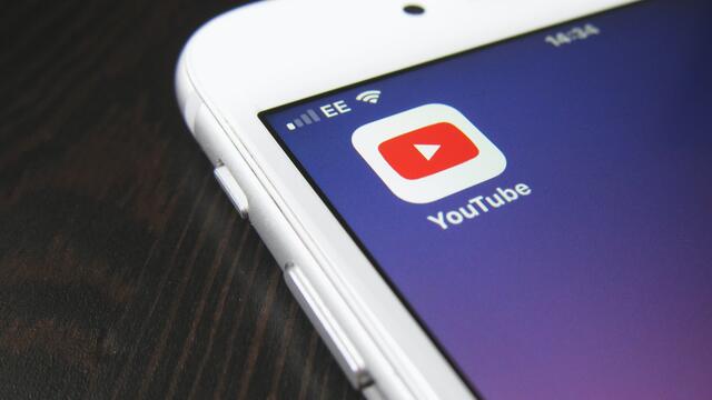 YouTube app logo displayed on a mobile phone screen